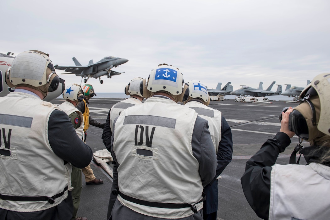 SECNAV Carlos Del Toro watches flight operations aboard USS Dwight D. Eisenhower (CVN 69).