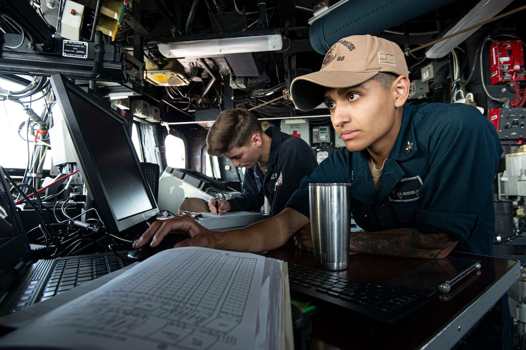 Sailors tand watch aboard USS Paul Hamilton (DDG 60) in the Gulf of Oman.