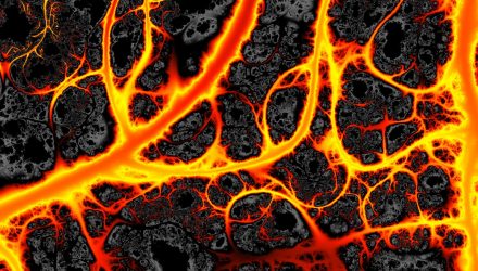 Veins of hot glowing orange lava flowing through vein-like channels in dark black volcanic rock.