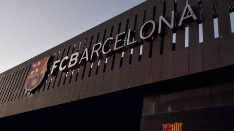 This photograph taken on August 5, 2021 shows the logo of FC Barcelona on the facade of the Camp Nou stadium in Barcelona. - Lionel Messi will end his 20-year career with Barcelona after the Argentine superstar failed to reach agreement on a new deal with the club, the Spanish giants announced on August 5, 2021. (Photo by Pau BARRENA / AFP) (Photo by PAU BARRENA/AFP via Getty Images)