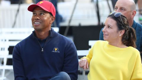 MELBOURNE, AUSTRALIA - DECEMBER 06:  Tiger Woods and his girlfriend Erica Herman look on during a Presidents Cup media opportunity at the Yarra Promenade on December 5, 2018 in Melbourne, Australia. The Presidents Cup 2019 will be held on December 9-15, 2019, when it returns to the prestigious Royal Melbourne Golf Club in Australia.  