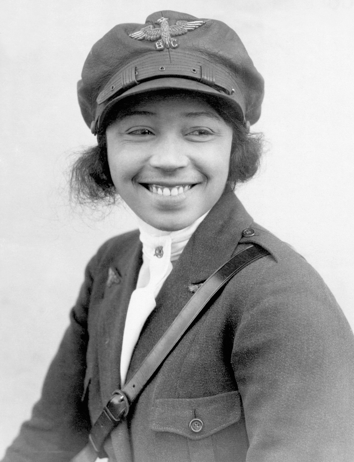 Black and white portrait image of Bessie Coleman smiling.