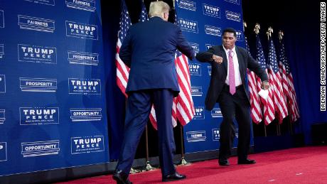 US President Donald Trump is greeted by NFL hall of fame member Herschel Walker during an event for black supporters at the Cobb Galleria Centre September 25, 2020, in Atlanta, Georgia.