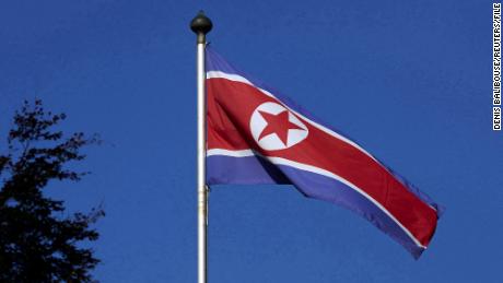 FILE PHOTO: A North Korean flag flies on a mast at the Permanent Mission of North Korea in Geneva October 2, 2014.  REUTERS/Denis Balibouse/File Photo