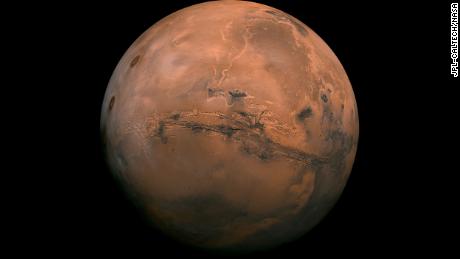 July 9, 2013

Mosaic of the Valles Marineris hemisphere of Mars projected into point perspective, a view similar to that which one would see from a spacecraft. The distance is 2500 kilometers from the surface of the planet, with the scale being .6km/pixel. The mosaic is composed of 102 Viking Orbiter images of Mars. The center of the scene (lat -8, long 78) shows the entire Valles Marineris canyon system, over 2000 kilometers long and up to 8 kilometers deep, extending form Noctis Labyrinthus, the arcuate system of graben to the west, to the chaotic terrain to the east. Many huge ancient river channels begin from the chaotic terrain from north-central canyons and run north. The three Tharsis volcanoes (dark red spots), each about 25 kilometers high, are visible to the west. South of Valles Marineris is very ancient terrain covered by many impact craters.

Credit
NASA/JPL-Caltech