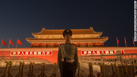 A Chinese paramilitary police officer secures the front gate of the Forbidden City in Beijing on September 28, 2017. 
China will convene its 19th Party Congress on October 18, state media said, a key meeting held every five years where President Xi Jinping is expected to receive a second term as the ruling Communist Partys top leader. / AFP PHOTO / NICOLAS ASFOURI        (Photo credit should read NICOLAS ASFOURI/AFP/Getty Images)