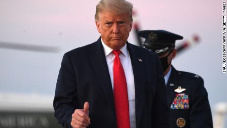 US President Donald Trump gives a thumbs up as he walks to board Air Force One prior to departing from Joint Base Andrews in Maryland, October 20, 2020, as he travels to campaign in Pennsylvania. (Photo by SAUL LOEB / AFP) (Photo by SAUL LOEB/AFP via Getty Images)