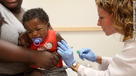 MIAMI, FL - JUNE 02: India Ampah holds her son, Keon Lockhart, 12 months old, as pediatrician Amanda Porro M.D. administers a measles vaccination during a visit to the Miami Children&#39;s Hospital on June 02, 2014 in Miami, Florida. The Centers for Disease Control and Prevention last week announced that in the United States they are seeing the most measles cases in 20 years as they warned clinicians, parents and others to watch for and get vaccinated against the potentially deadly virus. (Photo by Joe Raedle/Getty Images)