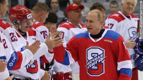 SOCHI, RUSSIA - MAY,10 (RUSSIA OUT) Russian President Vladimir Putin (C) greets billionaire and businessman Vladimir Potanin (L) as billionaire Gennady Timchenko (R) looks on during a group photo at the gala match of the Night Hockey League at Bolshoi Ice Dome in Sochi, Russia, May,10, 2019. Vladimir Putin scored 10 goals, and his team the Hockey Stars won 14:7 in this match against the Night Hockey League team.