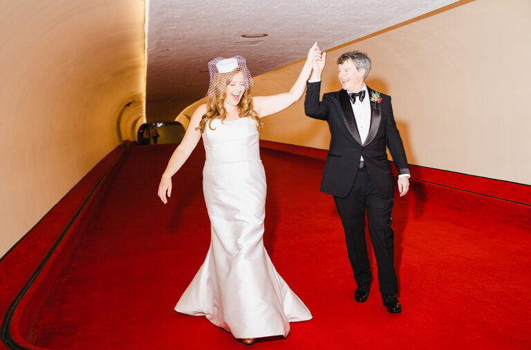 Rachel Honig and Grad Conn head to their reception after their wedding ceremony. The two were married Dec. 10 at The TWA Hotel at Kennedy Airport.