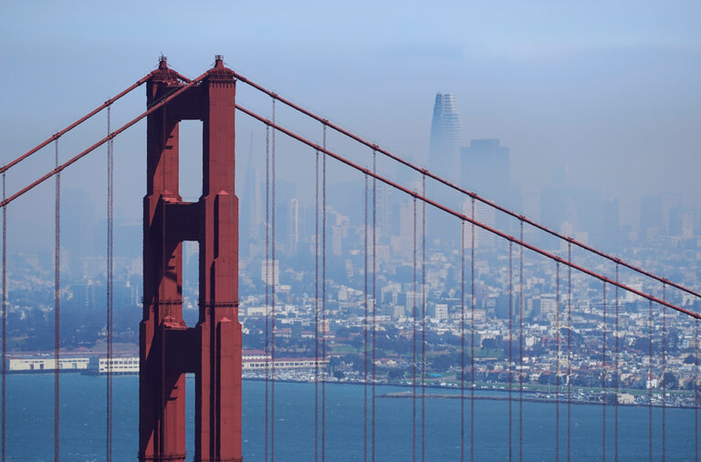 The San Francisco skyline is obscured by smoke from wildfires. Covid-19 and smoke is a dangerous combination, as both affect the respiratory system, making those exposed to the virus more vulnerable.