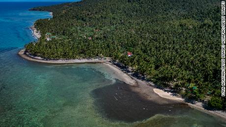 An aerial view shows an oil slick from the sunken tanker MT Princess Empress on March 8, 2023 in Pola, Oriental Mindoro, Philippines. 