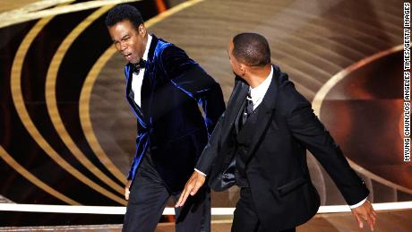 HOLLYWOOD, CA - March 27, 2022.    Will Smith slaps Chris Rock onstage during the show  at the 94th Academy Awards at the Dolby Theatre at Ovation Hollywood on Sunday, March 27, 2022.  (Myung Chun / Los Angeles Times via Getty Images)