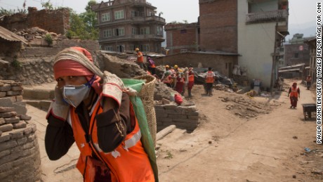 In Sankhu, a small village devastated by the earthquake 100 local workers hired by the IOM clear rocks and dirt almost a year after the earthquake.