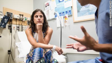 Boston, MA - 06/07/18 -- Kate Weissman meets with her oncologist Dr. Whitfield Growdon, at Massachusetts General Hospital on August 7, 2018, in Boston, Massachusetts. After a long battle with cervical cancer, fighting with her insurance company to pay for her treatment, and finally having to pay $95,000 up front for advanced photon-beam radiation therapy, Kate Weissman is cancer free - this is a follow-up appointment with her oncologist to get the all-clear. (Kayana Szymczak for CNN)