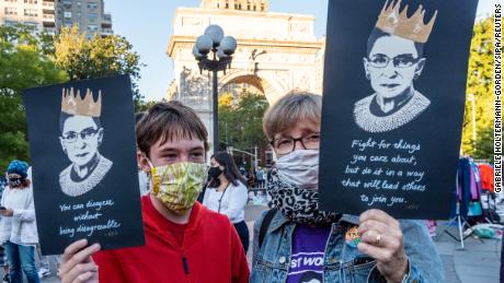 New Yorkers gather for a vigil remembering and honoring the life of Supreme Court Justice Ruth Bader Ginsburg in Washington Square Park in New York City on September 19, 2020. Brooklyn-born Ruth Bader Ginsburg, aka Notorious RBG, died on Friday 19, 2020, after a battle with pancreatic cancer. 