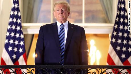 WASHINGTON, DC - OCTOBER 05: U.S. President Donald Trump stands on the Truman Balcony after returning to the White House from Walter Reed National Military Medical Center on October 05, 2020 in Washington, DC. Trump spent three days hospitalized for coronavirus. (Photo by Win McNamee/Getty Images)