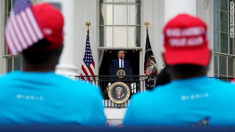 President Donald Trump speaks from the Blue Room Balcony of the White House to a crowd of supporters, Saturday, Oct. 10, 2020, in Washington. (AP Photo/Alex Brandon)