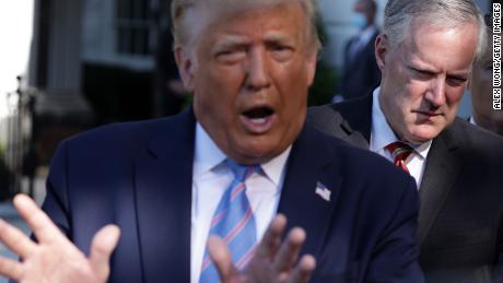 WASHINGTON, DC - JULY 29:  U.S. President Donald Trump speaks as White House Chief of Staff Mark Meadows (R) listens prior to Trump&#39;s Marine One departure from the South Lawn of the White House July 29, 2020 in Washington, DC. President Trump is traveling to visit the Double Eagle Energy oil rig in Midland, Texas, and will attend a fundraising luncheon for the Republican Party and his reelection campaign.  (Photo by Alex Wong/Getty Images)