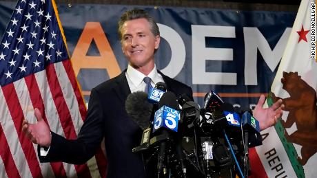 California Gov. Gavin Newsom addresses reporters after beating back the recall attempt that aimed to remove him from office, at the John L. Burton California Democratic Party headquarters in Sacramento, Calif., Tuesday, Sept. 14, 2021. (AP Photo/Rich Pedroncelli)