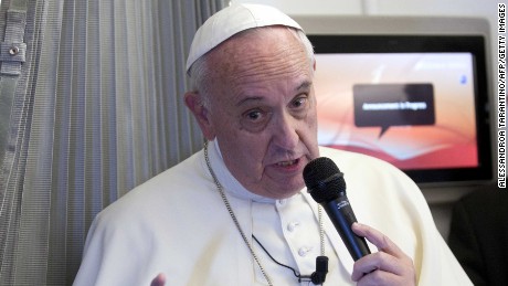 Pope Francis speaks to the press aboard a plane during his trip to the Philippines on January 15, 2015. Pope Francis arrived in the Philippines on January 15 for a five-day trip in the Catholic Church&#39;s passionate and chaotic Asian heartland that is tipped to attract a world-record papal crowd. 