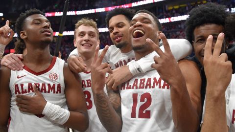 Mar 12, 2023; Nashville, TN, USA;  Alabama Crimson Tide guard Jaden Bradley (0), center Charles Bediako (14), guard Jahvon Quinerly (5), guard Adam Cottrell (30), guard Delaney Heard (12), and guard Rylan Griffen (3) celebrate the win against the Texas A&M Aggies during the second half at Bridgestone Arena. Mandatory Credit: Steve Roberts-USA TODAY Sports