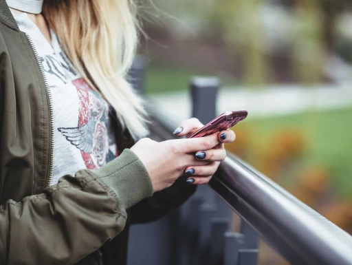 young woman holding mobile phone