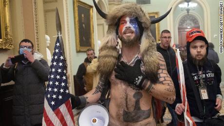 WASHINGTON, DC - JANUARY 06:  A pro-Trump mob confronts U.S. Capitol police outside the Senate chamber of the U.S. Capitol Building on January 06, 2021 in Washington, DC. Congress held a joint session today to ratify President-elect Joe Biden&#39;s 306-232 Electoral College win over President Donald Trump. A group of Republican senators said they would reject the Electoral College votes of several states unless Congress appointed a commission to audit the election results. (Photo by Win McNamee/Getty Images)
