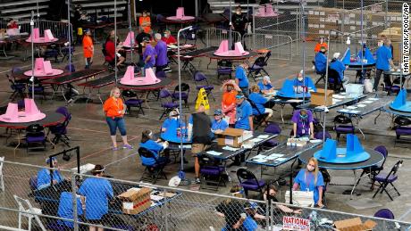 Maricopa County ballots cast in the 2020 general election are examined and recounted by contractors working for Florida-based company, Cyber Ninjas, Thursday, May 6, 2021 at Veterans Memorial Coliseum in Phoenix. The audit, ordered by the Arizona Senate, has the U.S. Department of Justice saying it is concerned about ballot security and potential voter intimidation arising from the unprecedented private recount of the 2020 presidential election results. (AP Photo/Matt York, Pool)