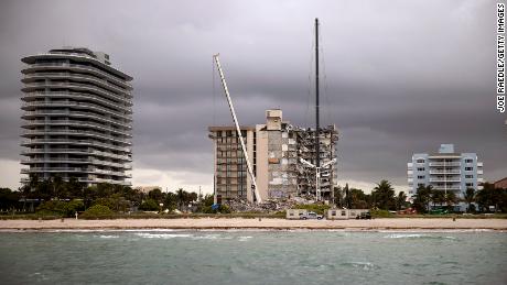 SURFSIDE, FLORIDA - JUNE 28: Search and Rescue teams look for possible survivors and to recover remains in the partially collapsed 12-story Champlain Towers South condo building on June 28, 2021 in Surfside, Florida. Over one hundred people are being reported as missing as the search-and-rescue effort continues. (Photo by Joe Raedle/Getty Images)