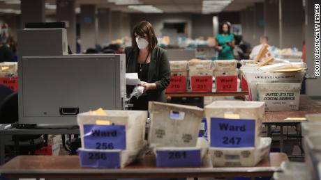 Claire Woodall-Vogg, executive director of the Milwaukee election commission collects the count from absentee ballots from a voting machine on November 04, 2020 in Milwaukee, Wisconsin. 