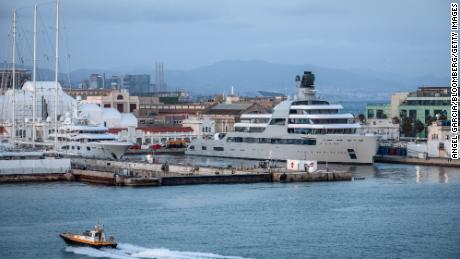 A pilot boat passes the Solaris superyacht, right, owned by Russian billionaire Roman Abramovich, in Barcelona, Spain, on March 1, 2022. The Russian billionaire handed direct control of Chelsea F.C. to the trustees of its charitable foundation and he&#39;s also selling his London properties, British lawmaker Chris Bryant said in Parliament. Photographer: Angel Garcia/Bloomberg/Getty Images