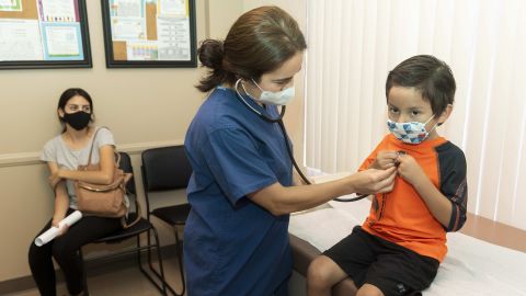 Ladera Ranch, CA - July 28: Dr. Kate Williamson lets a child listen to his heart during a yearly routine exam as his mom watches at Southern Orange County Pediatric Associates in Ladera Ranch, CA on Tuesday, July 28, 2020. Kids and teens 17 and under make up far less than their share of COVID-19 cases in relation to their proportion of Orange Countys overall population. Testing rates could also be a factor in the lower numbers as kids dont show symptoms like older people do.