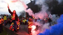 CGT unionists light flares on the ring road as they block the traffic to protest, a day after the French government pushed a pensions reform through parliament without a vote, using the article 49,3 of the constitution, in Paris on March 17, 2023. - French President faces intensified protests and accusations of anti-democratic behaviour after pushing through a contentious pension reform without a parliamentary vote. (Photo by BERTRAND GUAY / AFP) (Photo by BERTRAND GUAY/AFP via Getty Images)