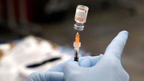 Nurse practitioner Sarah Rauner fills a syringe with the Pfizer Covid-19 vaccine to be administered to children from 5-11 years old are seen at the Beaumont Health offices in Southfield, Michigan on November 5, 2021. (Photo by JEFF KOWALSKY / AFP) (Photo by JEFF KOWALSKY/AFP via Getty Images)