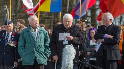 This picture taken on April 12, 2015 and handed out on March 21, 2022 by the Buchenwald and Mittelbau-Dora Memorials Foundation shows Holocaust survivor Boris Romanchenko (2nd R) as he stands next to other former prisoners of the Buchenwald Nazi concentration camp during a commemoration ceremony at the camp's memorial site in Buchenwald near Weimar, eastern Germany. - As the Buchenwald and Mittelbau-Dora Memorials Foundation said in a press release on March 21, 2022, Romanchenko, 96, was killed as his house in Kharkiv was hit by shelling during the Ukraine-Russia conflict. (Photo by Michael REICHEL / Buchenwald and Mittelbau-Dora Memorials Foundation / AFP) / RESTRICTED TO EDITORIAL USE - MANDATORY CREDIT "AFP PHOTO / Michael REICHEL / Buchenwald and Mittelbau-Dora Memorials Foundation" - NO MARKETING - NO ADVERTISING CAMPAIGNS - DISTRIBUTED AS A SERVICE TO CLIENTS (Photo by MICHAEL REICHEL/Buchenwald and Mittelbau-Dora Me/AFP via Getty Images)