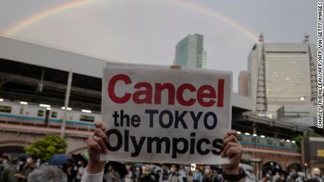 TOPSHOT - People take part in a protest against the hosting of the 2020 Tokyo Olympic Games in Tokyo on May 17, 2021. (Photo by Charly TRIBALLEAU / AFP) (Photo by CHARLY TRIBALLEAU/AFP via Getty Images)