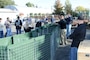 Employees from the U.S. Army Corps of Engineers Sacramento District assemble portable flood-water barriers during a product demonstration at a Corps facility here Nov. 3. Three new products are being tested by Corps employees for future use in emergency and disaster operations. “The district has several flood-fighting technologies stored across the nation so we can deploy them when and where we need to,” said district disaster program manager Christy Jones.