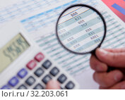 Finance analyst looking and financial reports. Стоковое фото, фотограф Elnur / Фотобанк Лори