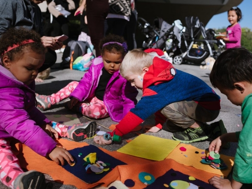 Kids sitting in Hirshhorn Plaza for STORYTIME program.