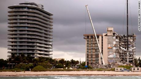 SURFSIDE, FLORIDA - JUNE 28: Search and Rescue teams look for possible survivors and to recover remains in the partially collapsed 12-story Champlain Towers South condo building on June 28, 2021 in Surfside, Florida. Over one hundred people are being reported as missing as the search-and-rescue effort continues. (Photo by Joe Raedle/Getty Images)