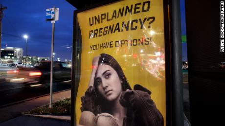 A billboard advertising adoption services targets pregnant women at a bus stop in Oklahoma City, Oklahoma, U.S., December 7, 2021. Picture taken December 7, 2021.  REUTERS/Evelyn Hockstein