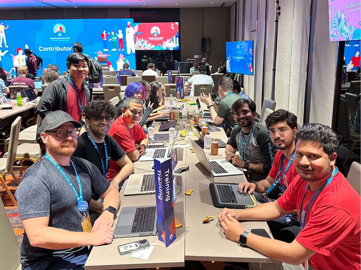 12 people sitting around the Training Team table at WordCamp Asia 2023 Contributor Day