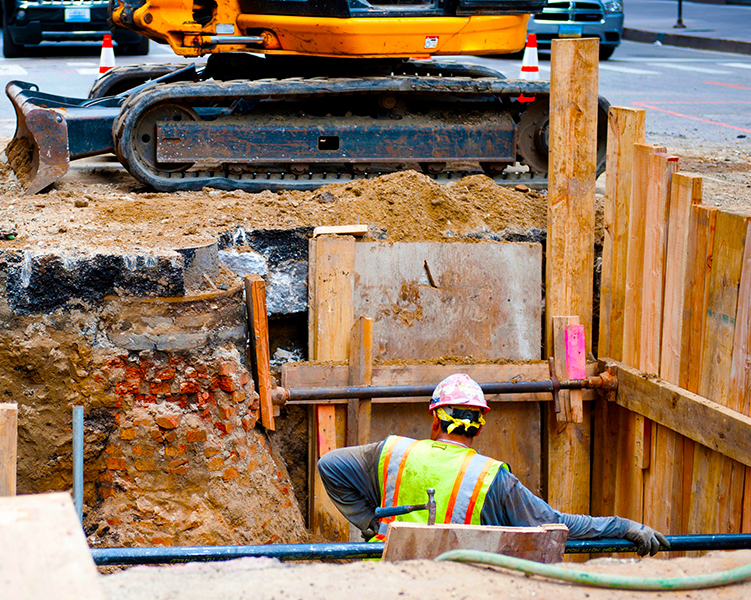 Construction worker in a trench