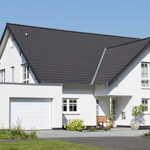 New house with black roof and one car garage