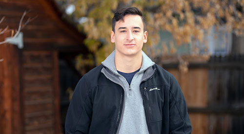 male veteran standing looking at camera