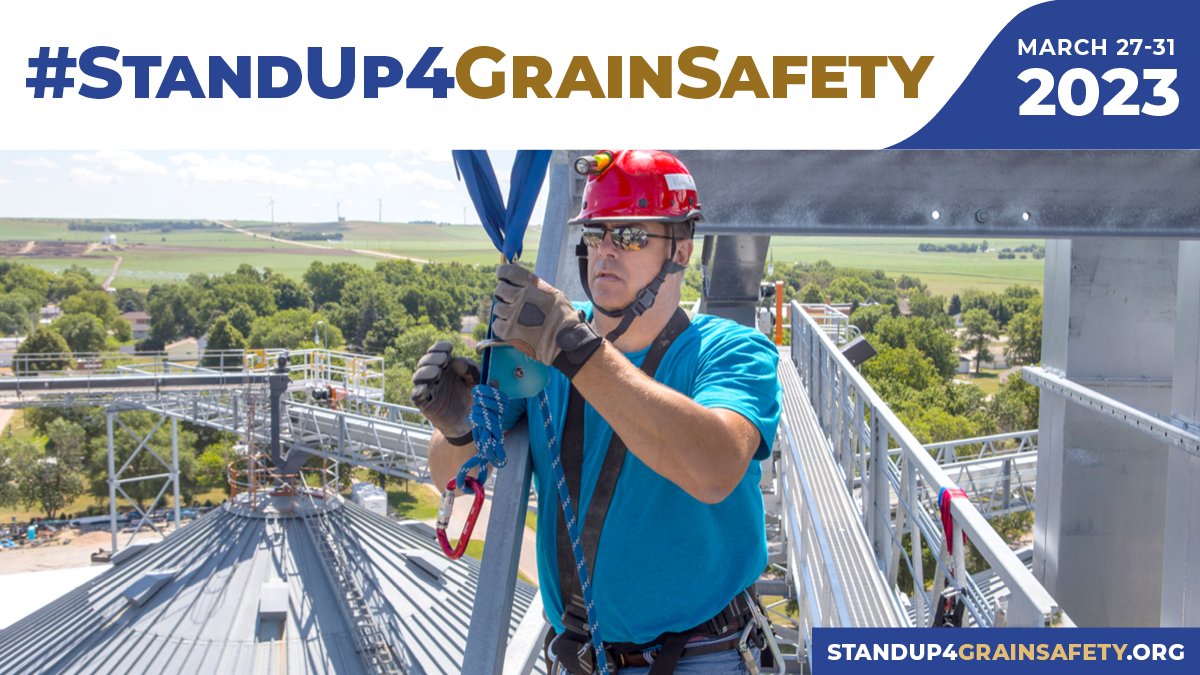 Photo of a man wearing a helmet and harness for fall protection before entering a grain storage bin. #StandUp4GrainSafety, March 27-31, 2023. StandUp4GrainSafety.org