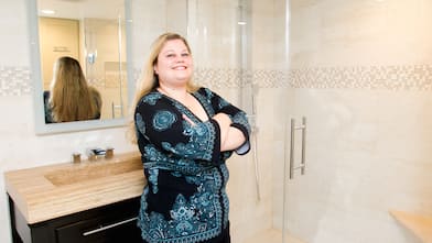 jessica khan in front of bathroom sink and shower