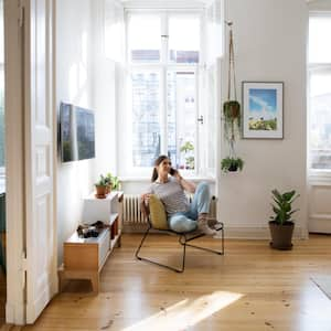 A woman at home sitting in her chair