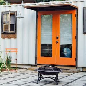 Shipping container house orange door patio